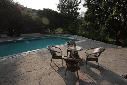 Poolside sitting area resort in alibaug